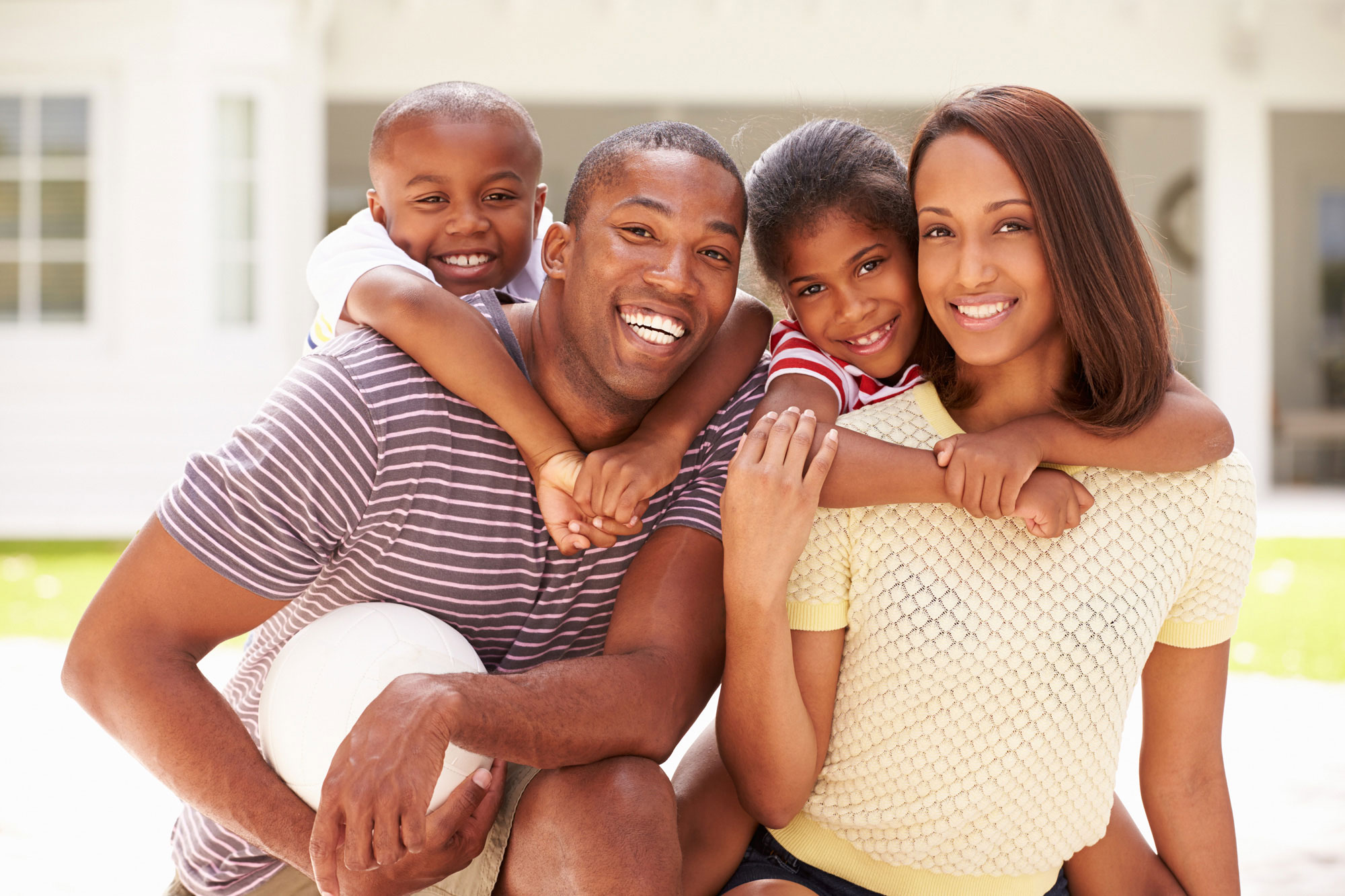 happy family outside their home 