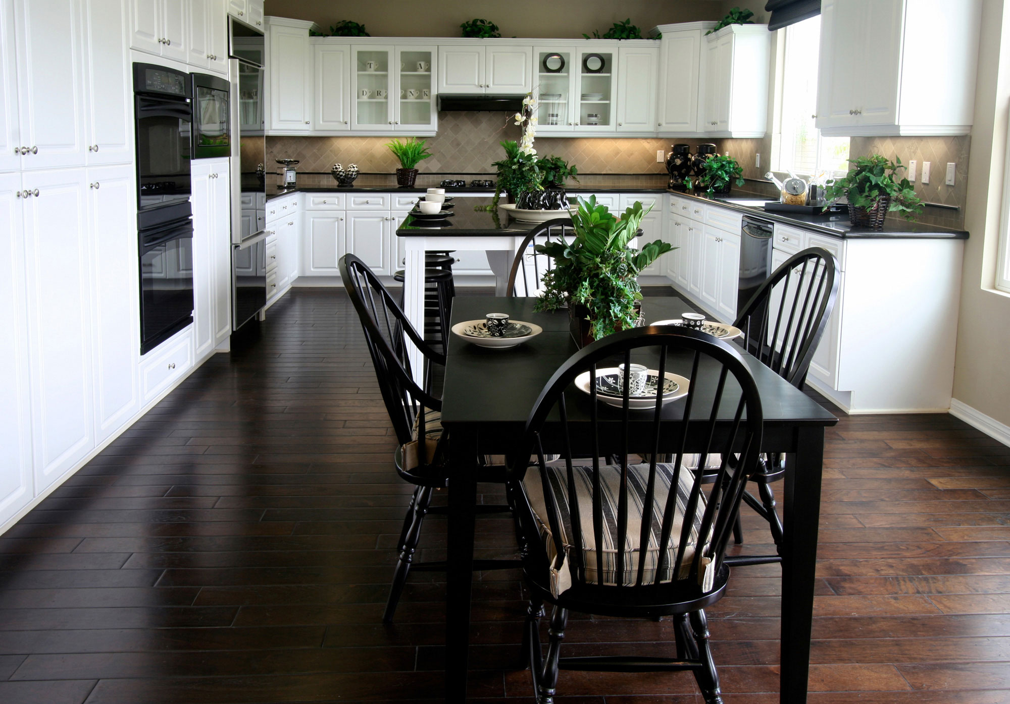 kitchen with white cabinets and black appliances 