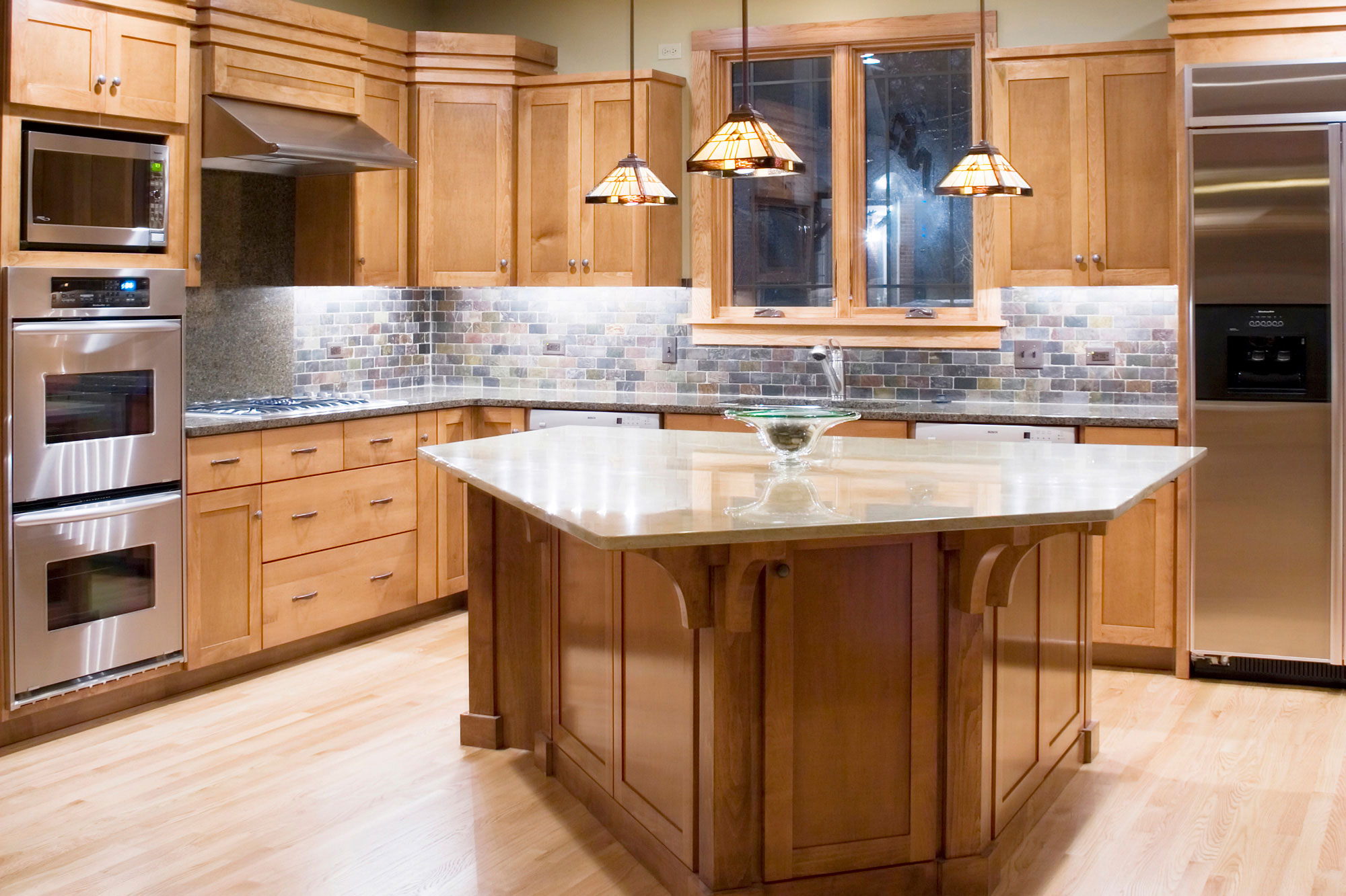 kitchen with wood cabinets and tile backsplash  